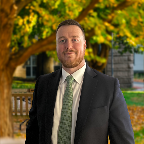 Headshot of Jack F. Donaghue in front of trees